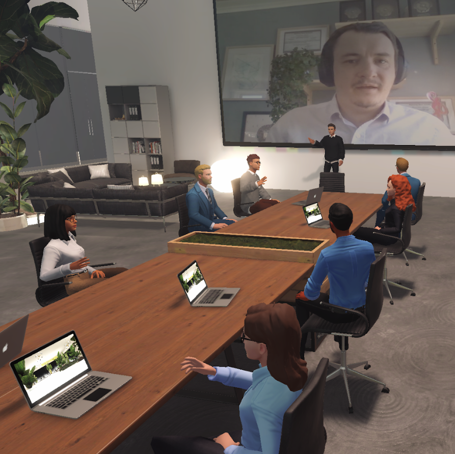 ReSocialize avatars gathered around a virtual convference table holding an online meeting. Remote workers, ReSocialize avatars are watching a remote presentation on a screen on the far wall
