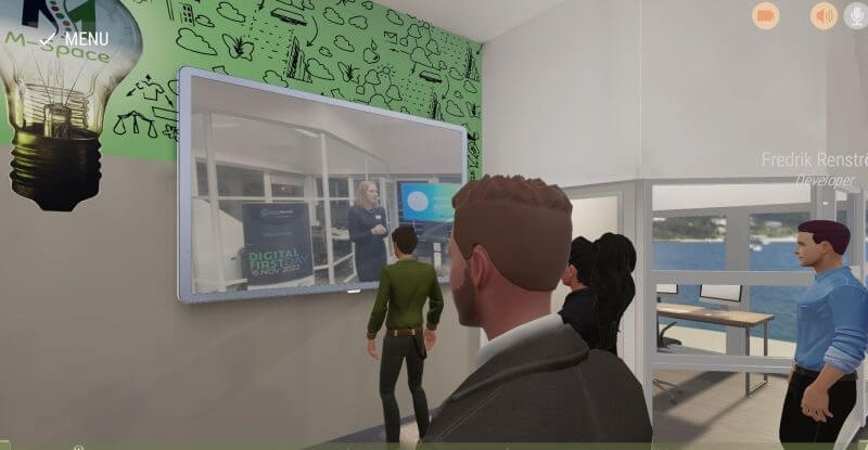 A hybrid webinar event in a metaverse meeting platform with several remote joining avatars watching a live stream from a physical event on a virtual screen - showcasing a solution to host better events. Online meeting tools perfect for networking at a webinar, showcasing the middle ground between webinar vs seminar Plans and pricing, this image highlights the ReSocialize event offering.